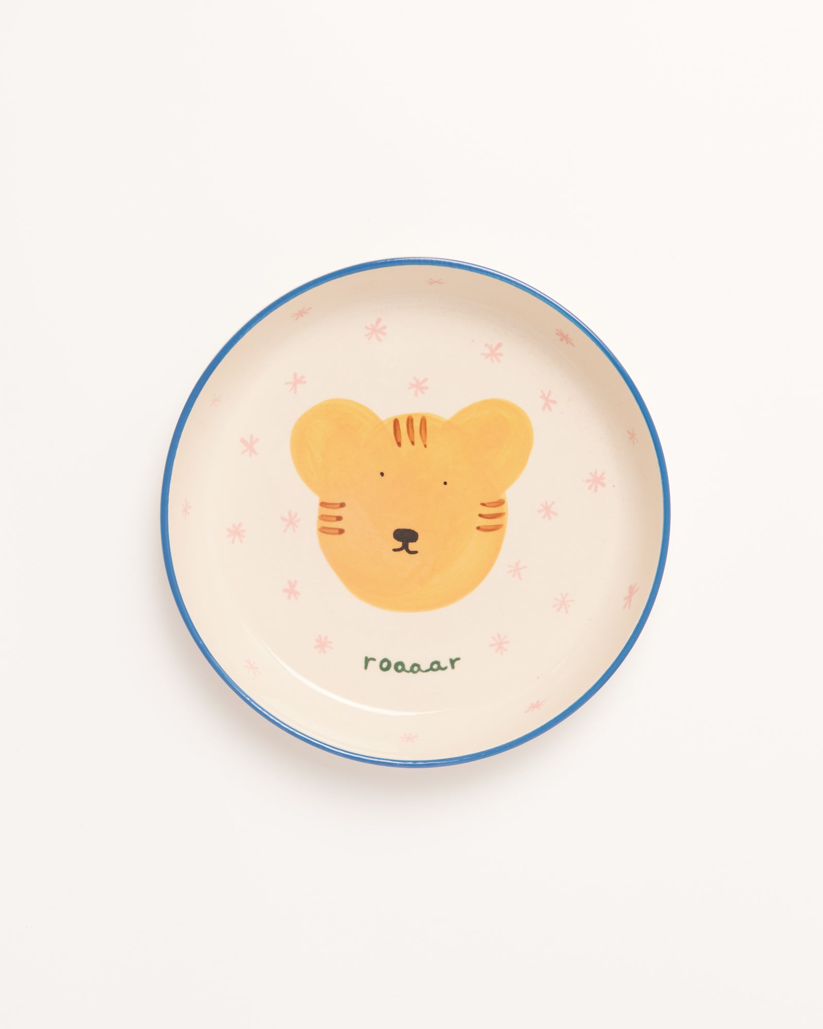 Beiger Teller mit blauem Rand, der ein Tigerkopf-Design in der Mitte und das Wort "roaaar" darunter zeigt.